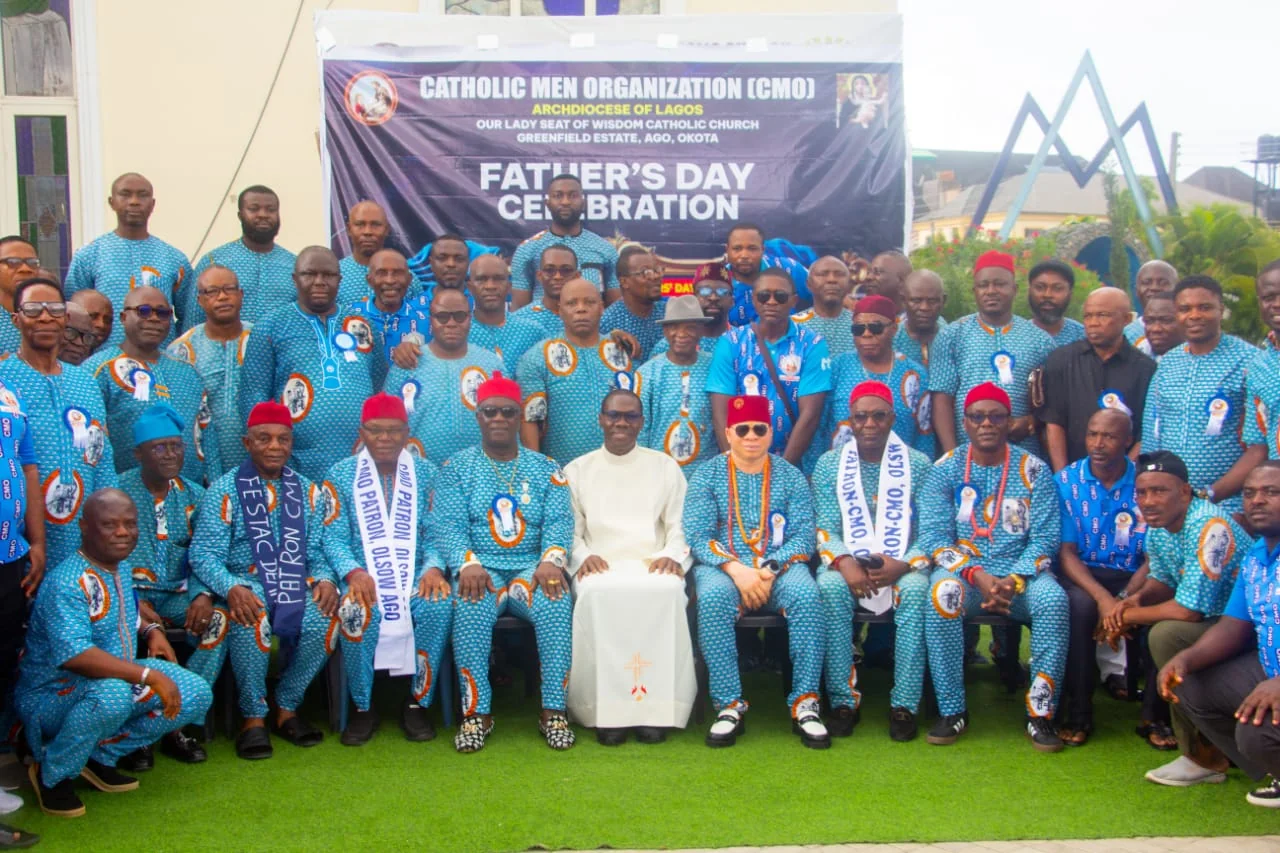 Group of men praying together inside a church, embodying brotherhood and shared faith